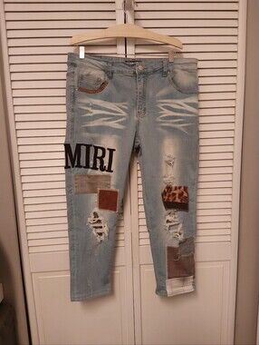AMIRI Light Blue Distressed Jeans with Patchwork